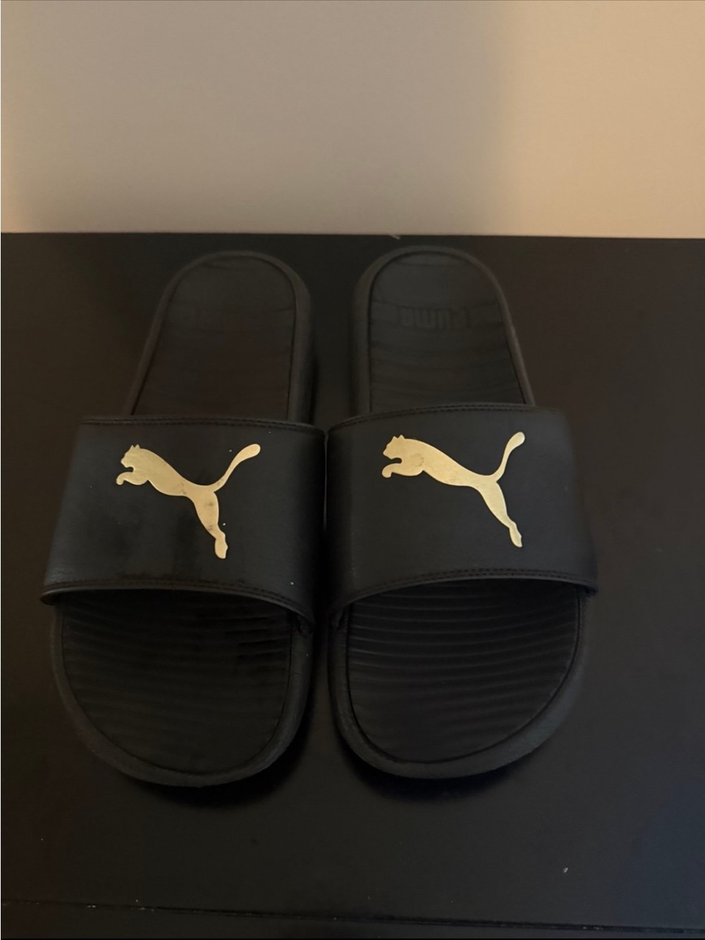 Puma Men’s Black Slides with Gold Puma Emblem